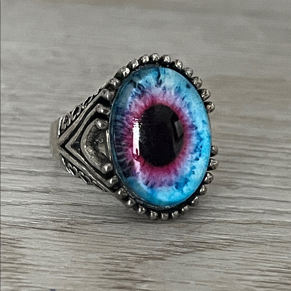 Silver Tone and Blue Eye Design Ring